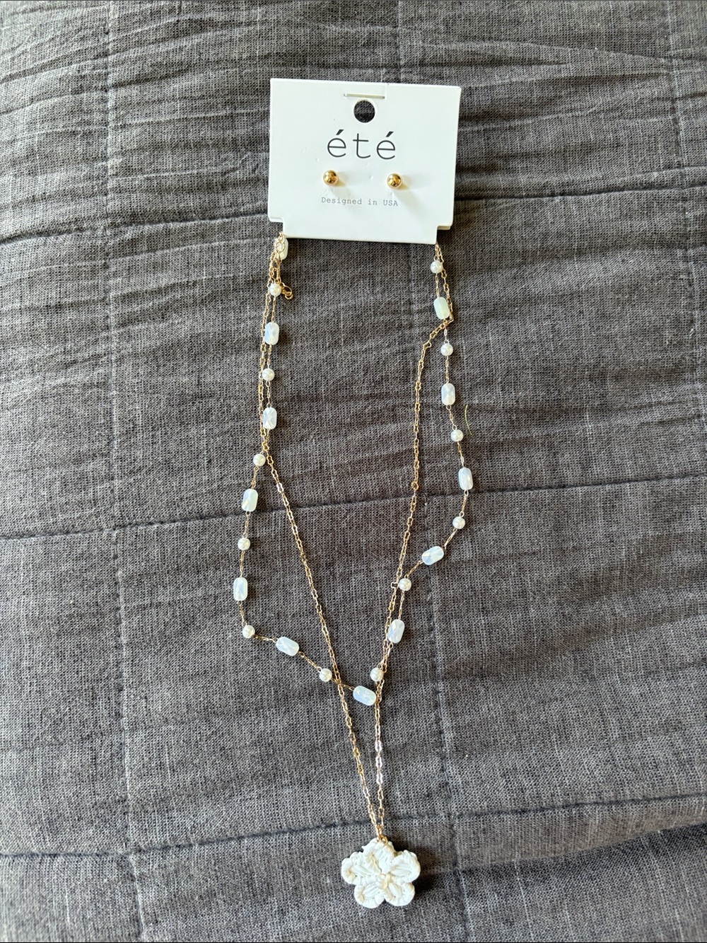 ETE Gold Layered Necklace with White Bead Accents and Floral Pendant